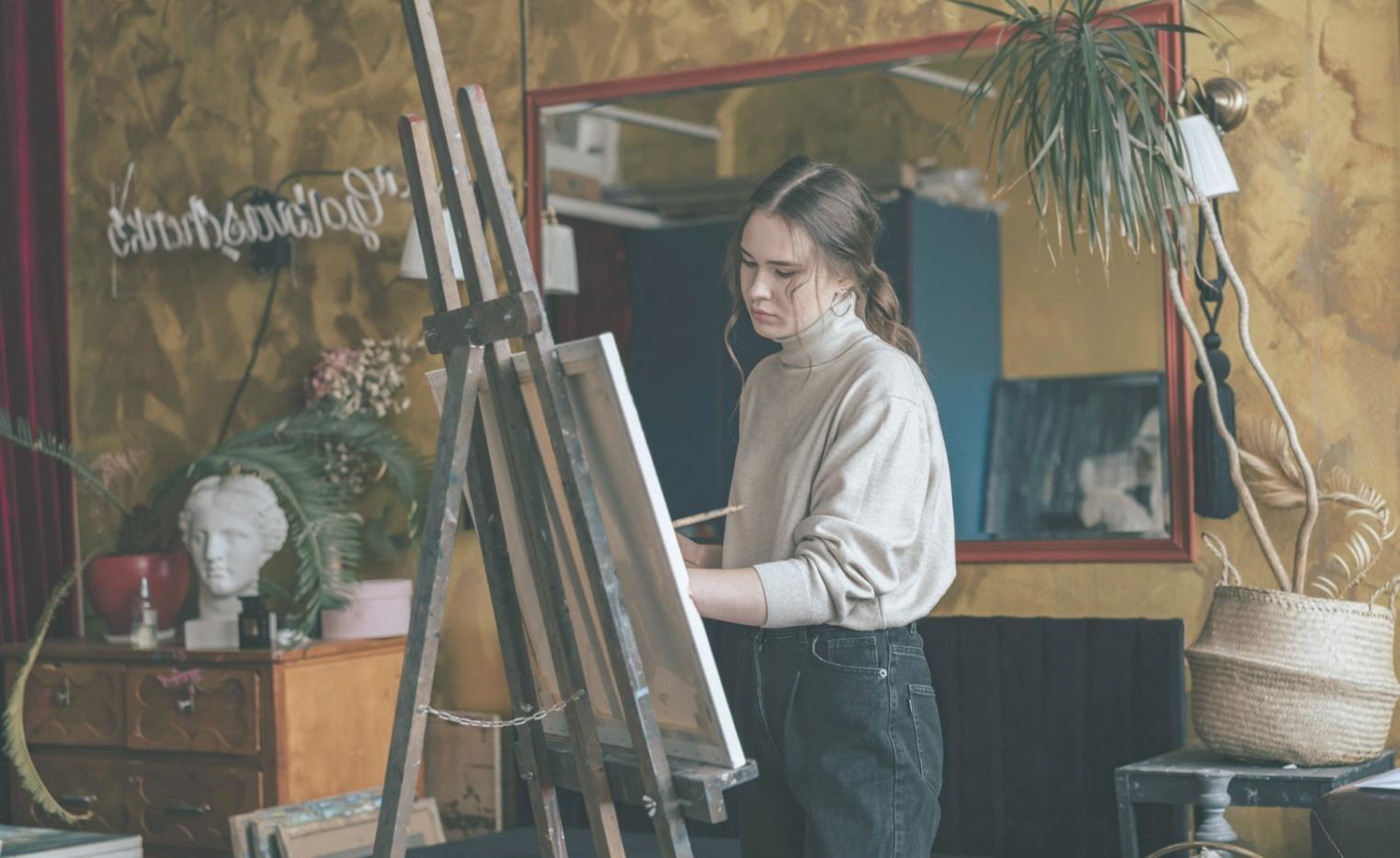 Watercolor painting workspace with brushes and palette