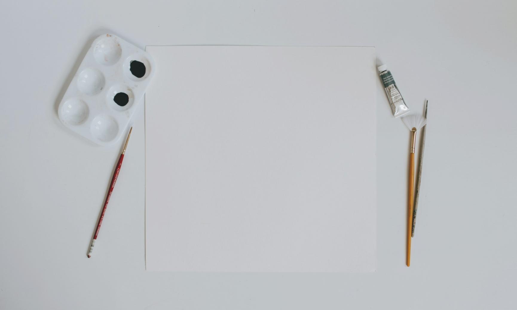 Watercolor illustration workspace showing brushes, paints, and work in progress